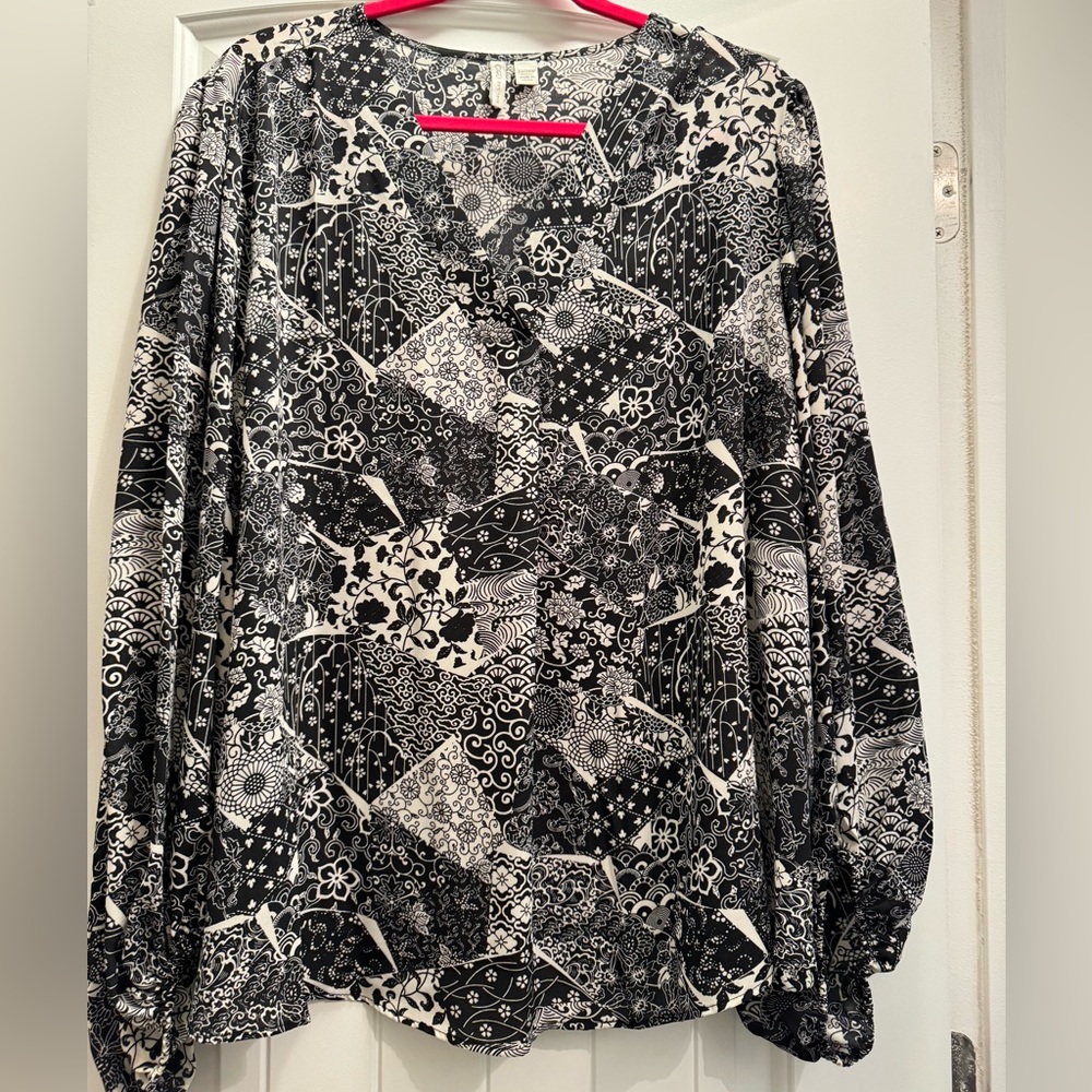 Black and white blouse, no tag, never been worn.
